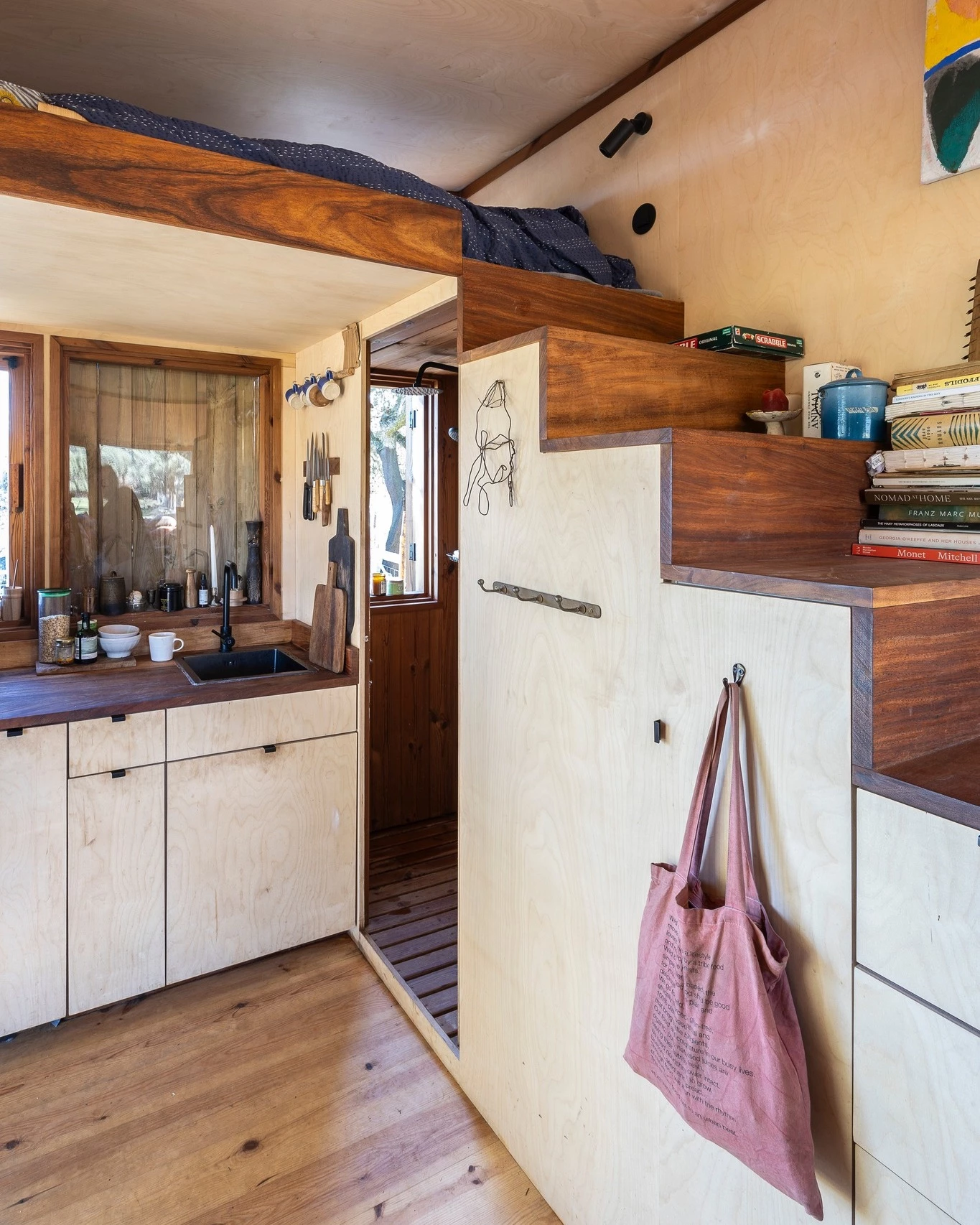 The Brava's kitchen connects to its bathroom, which contains a shower, sink, and toilet