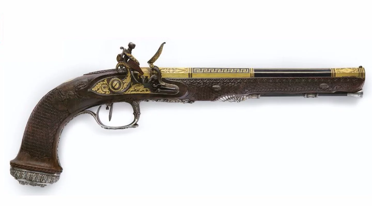 The pistols themselves are flintlocks featuring blued and gilt-swamped octagonal barrels with multi-groove rifling