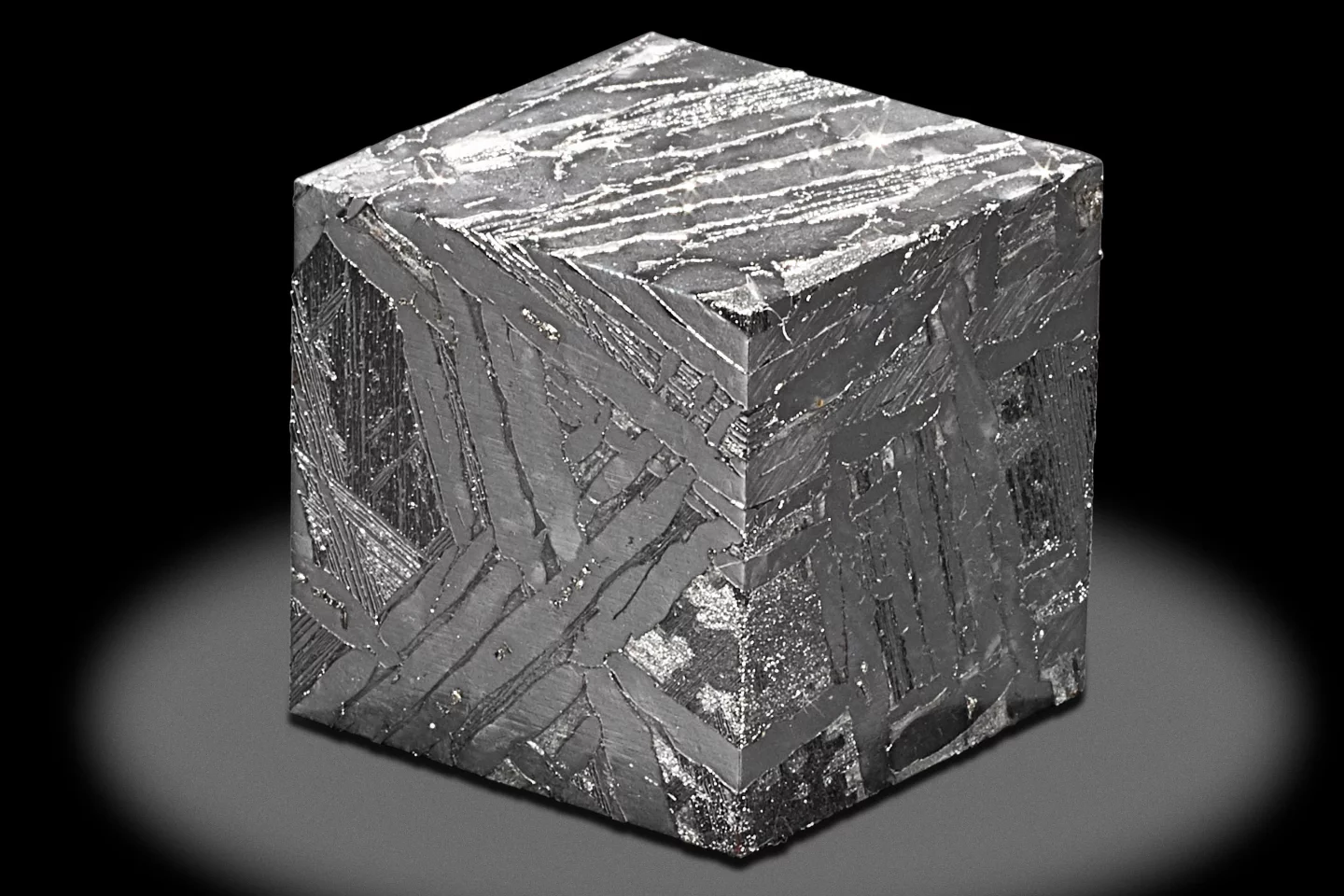 This 3.0 x 3.0 x 3.0 cm cube was cut from the Seymchan meteorite. It weighs 223.9 grams and has an estimate of US$2,200 to $2,800.