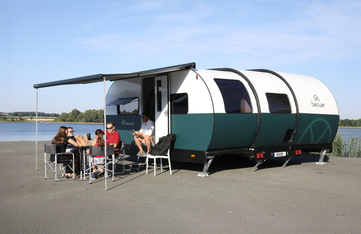 Oversized 8-sleeper camping cabin telescopes into slim travel trailer