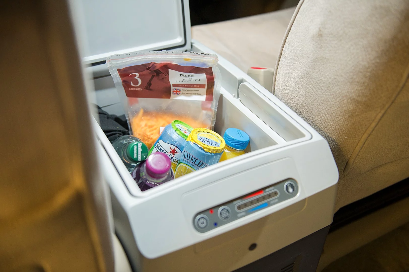 Whether you're driving to camp or working on dinner, the fridge keeps food and drink accessible