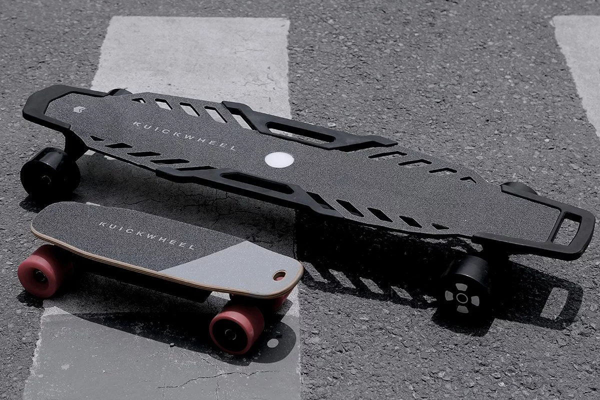 The Serpent-C (bottom left) and Serpent-W electric skateboards from Kuickwheel