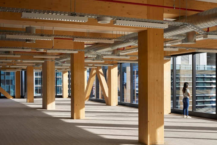 Floor-by-floor, huge exposed V-shaped columns were stacked on top of one another to support the timber slabs used for floor plates and exposed ceiling soffits inside 25 King