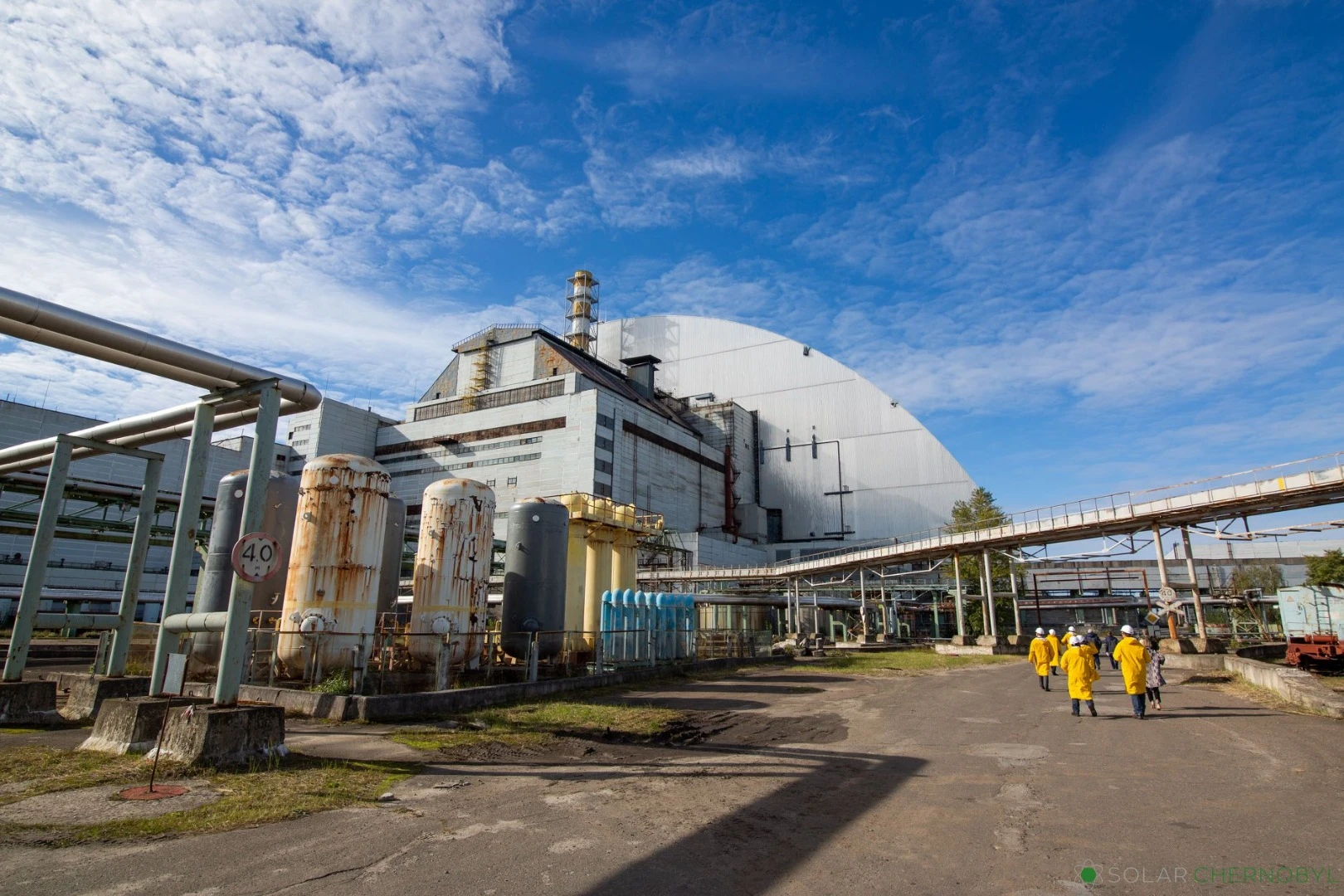 The solar panels of the Chernobyl Solar project sit just 100 m (328 ft) away from the site of Reactor 4, ground zero of the disaster