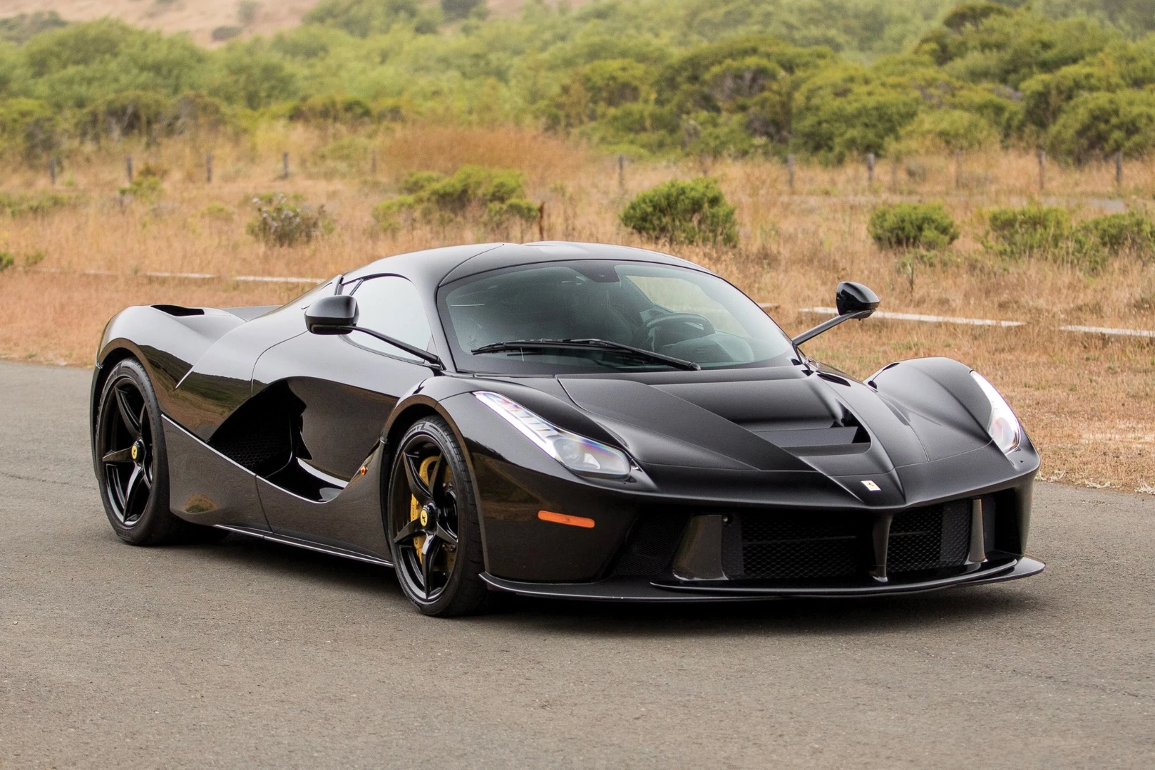 This 2014 Ferrari LaFerrari is estimated to sell for between $3,300,000 and $3,800,000. It has a top speed of 217 mph (350 km/h). The 6.3L hybrid drive V-12 engine develops 949 horsepower in total, with the hybrid power unit comprising the most powerful naturally-aspirated V12 in the world (6.3 liters producing 788 hp) with a 161 hp electric motor for a total 949 hp transmitted via a 7-speed dual clutch gearbox with energy harvested via a HY-KERS Kinetic Energy Recovery System. Official Auction Page