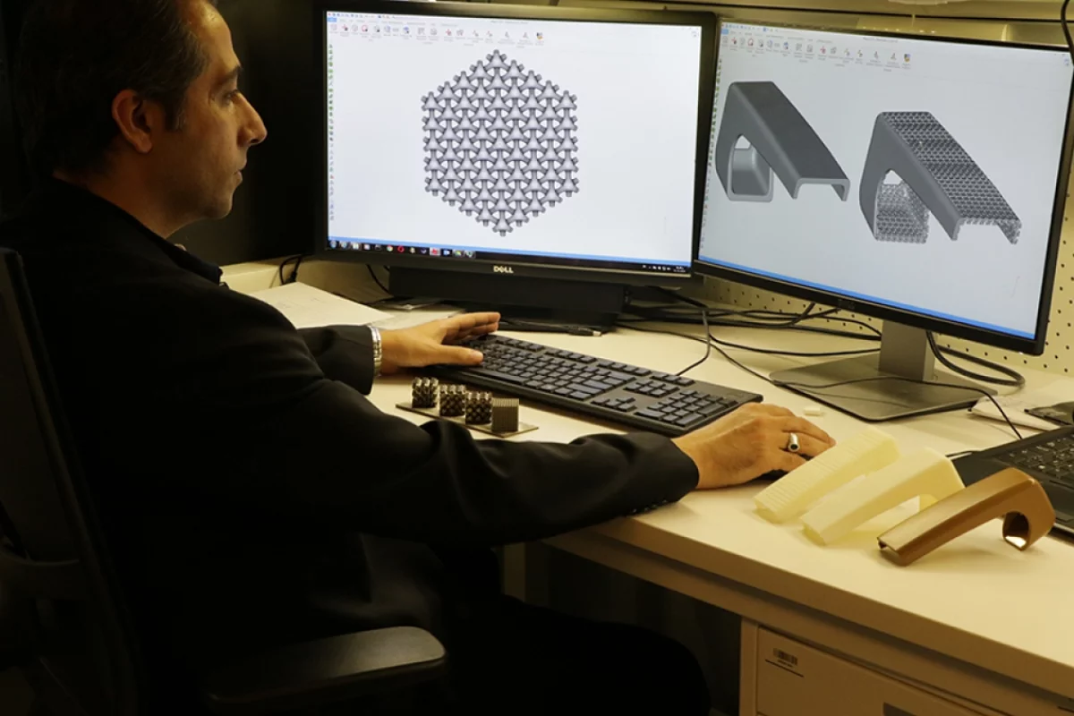 Masdar Institute’s Dr. Rashid Abu Al-Rub, Associate Professor of Mechanical and Materials Engineering, demonstrates how aerospace components, like armrests, can be made lighter with "architecture foams"