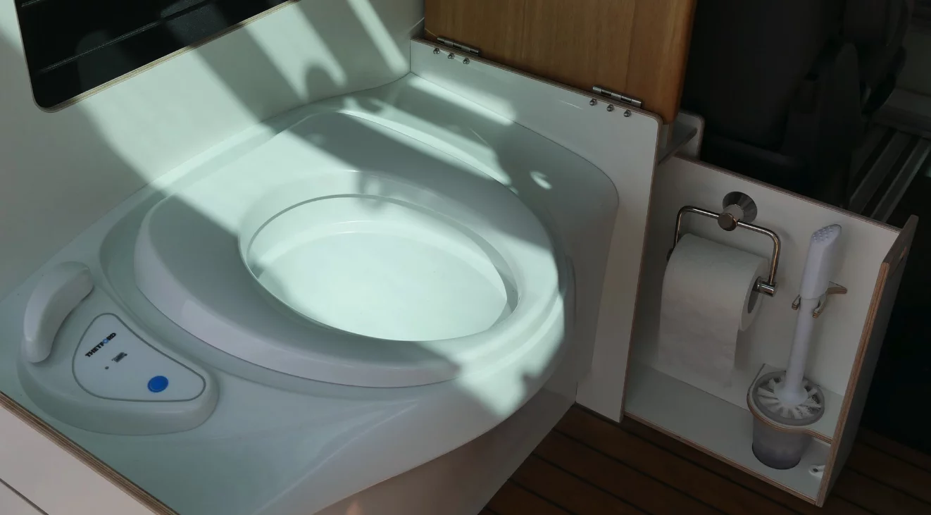 Slide-out toilet paper holder and brush