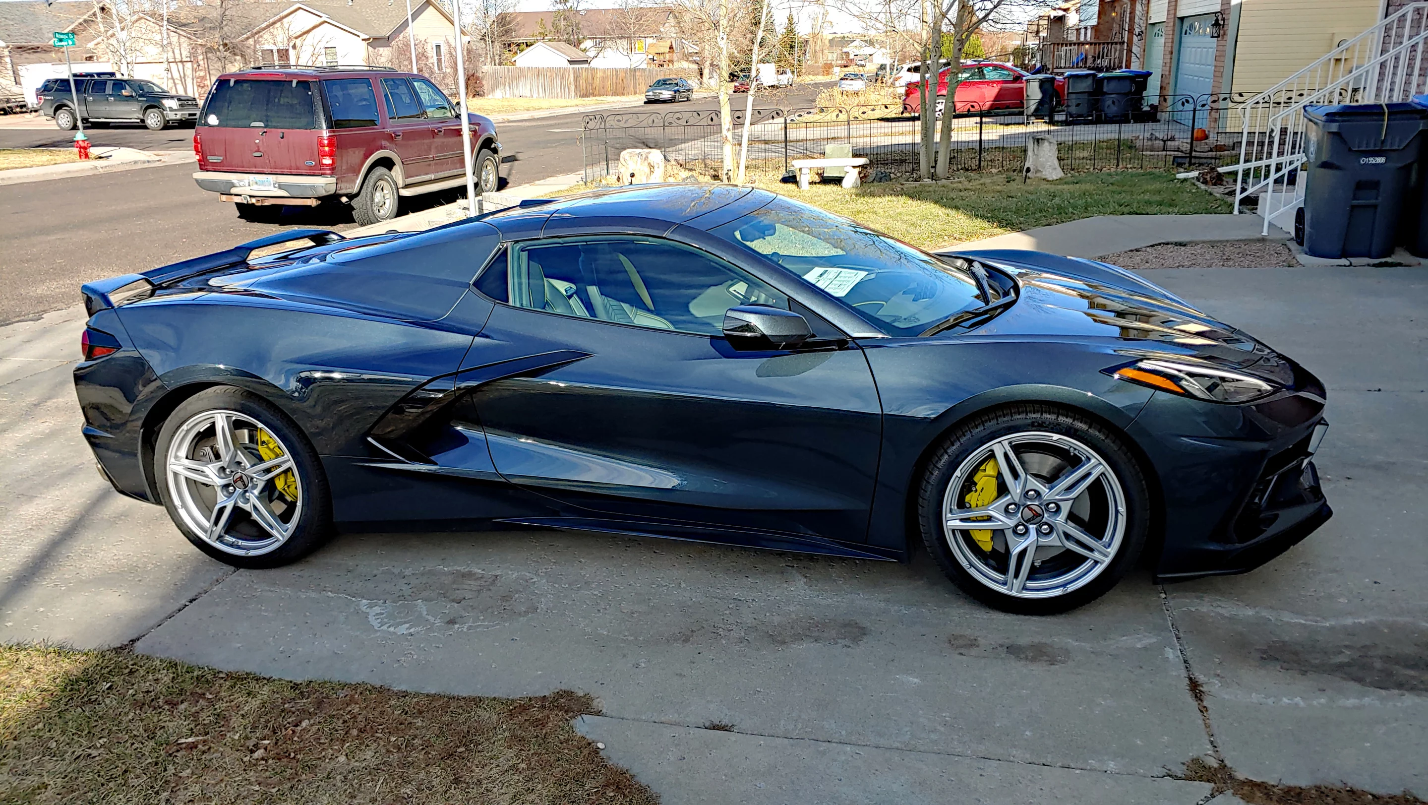 Sitting in the author's driveway, the C8 Corvette sports a Z51 color package with yellow brake calipers, seatbelts, and stitching