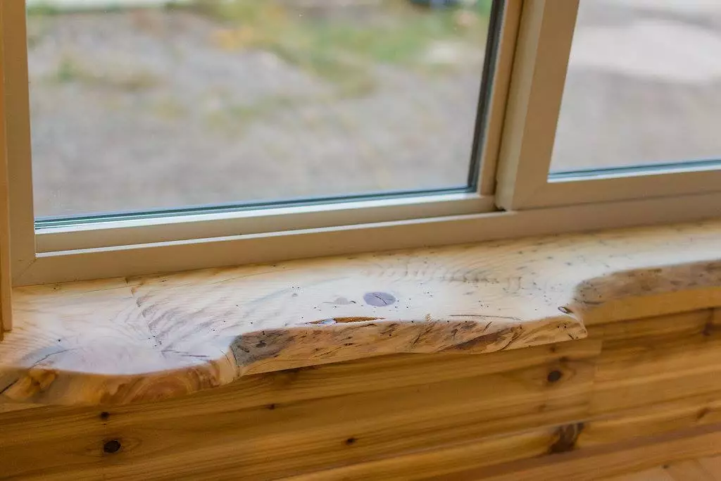 Davis's 22 ft Off-Grid Tiny Home features live edge window sills