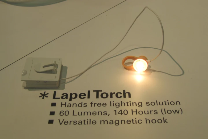 A small, magnetic clip on the back of the lamp lets you attach the Lapel Torch to your shirt.