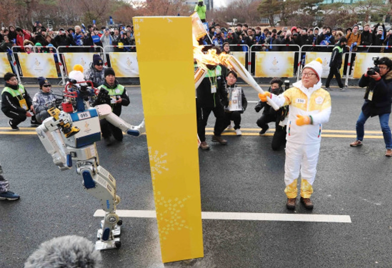 Handing off the flame through a wall