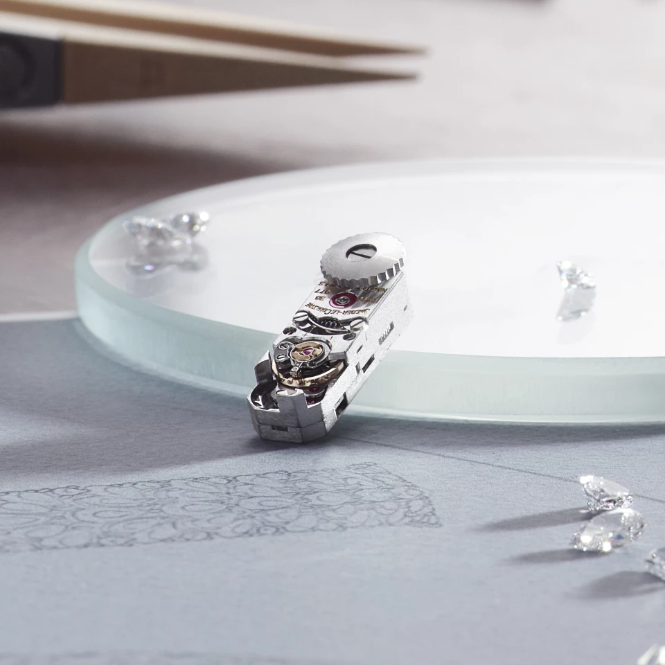 Calibre 101 uses a “stacked” dual-level architecture – the escapement is set on one plane, the barrel and cogs on another – and the mainspring is wound by a flat crown set into the base of the case – minuscule in size, it has enough spring for 33 hours of operation