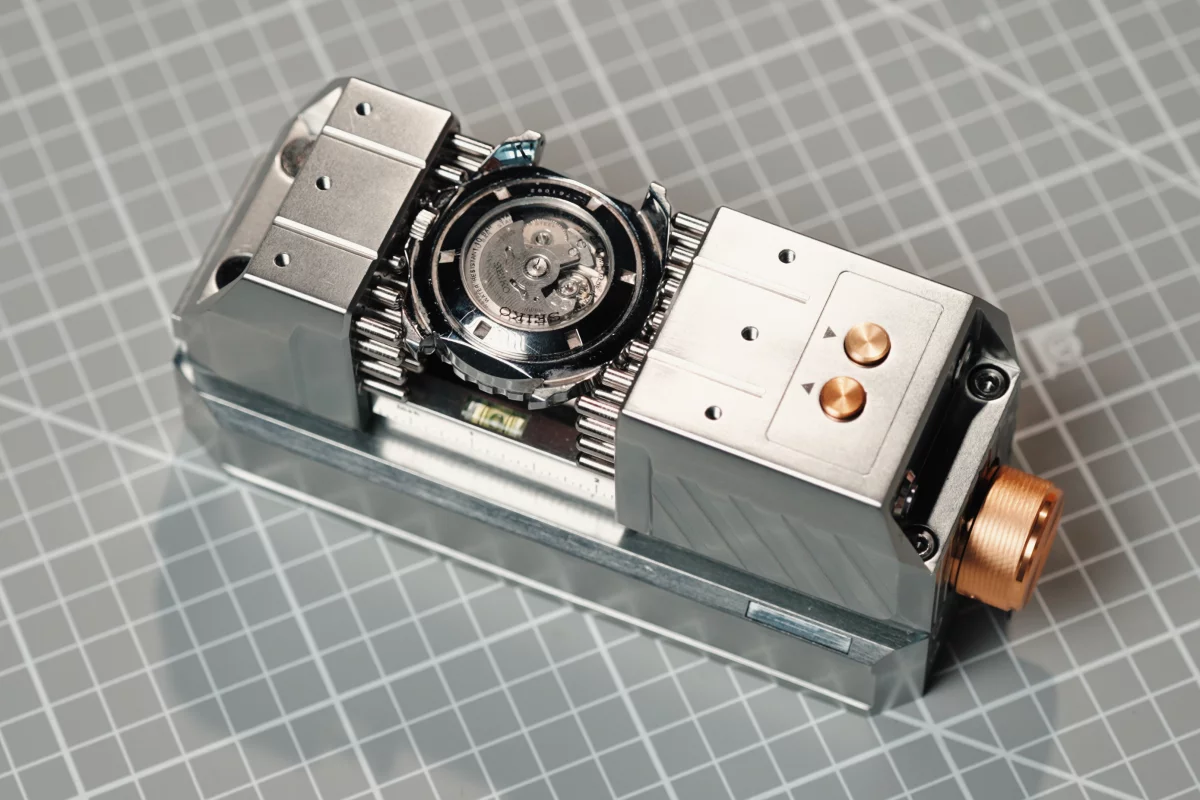 The K-One vise (pictured here holding a delicate wristwatch) is presently on Kickstarter