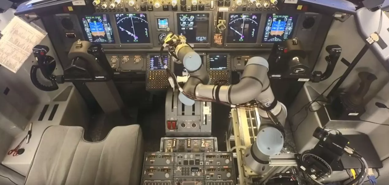 The ALIAS system operating the 737 controls using a robotic arm