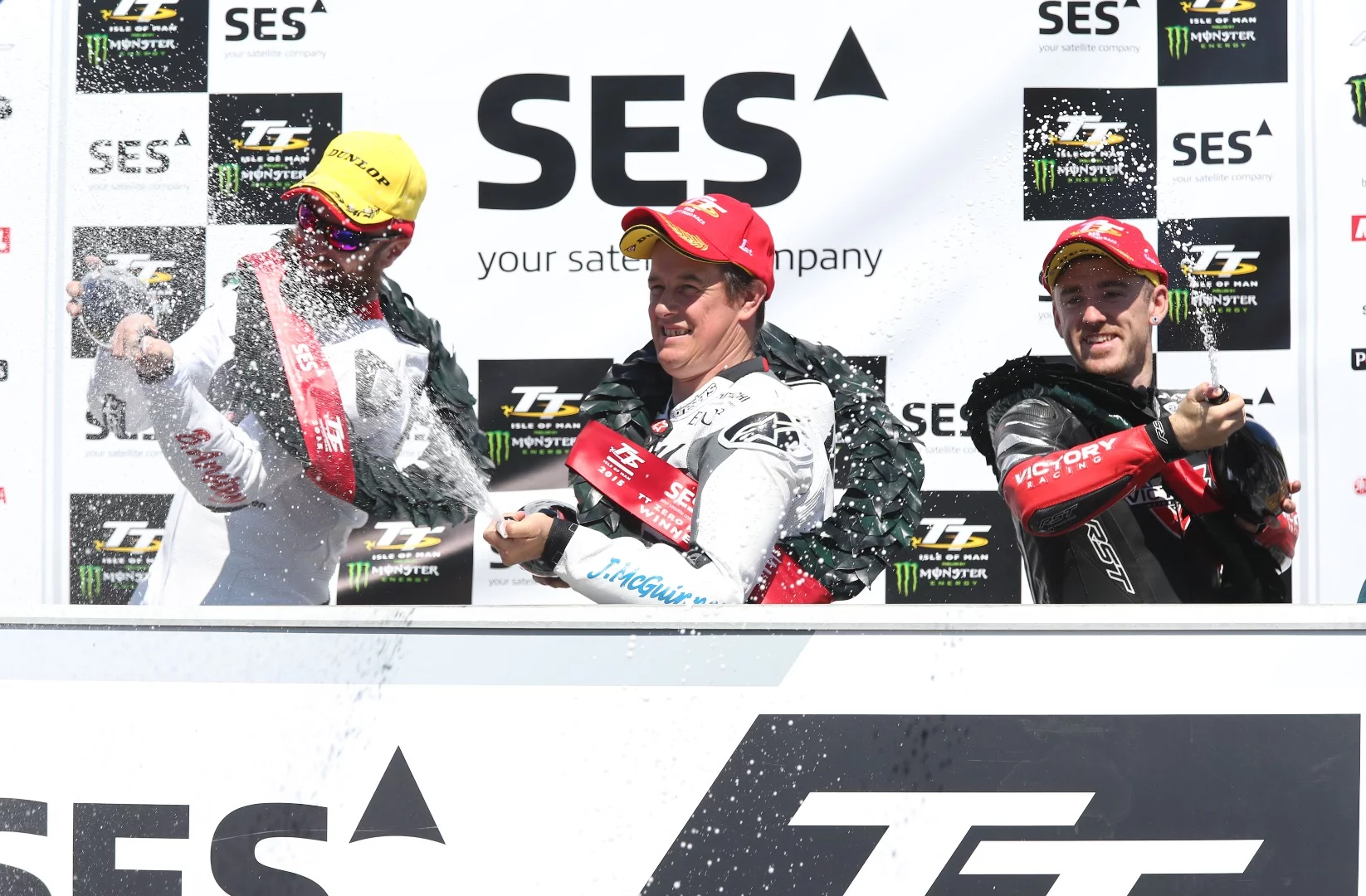 Three happy winners. From left to right, Bruce Anstey (Mugen), John McGuinness (Mugen), Lee Johnston (Victory)