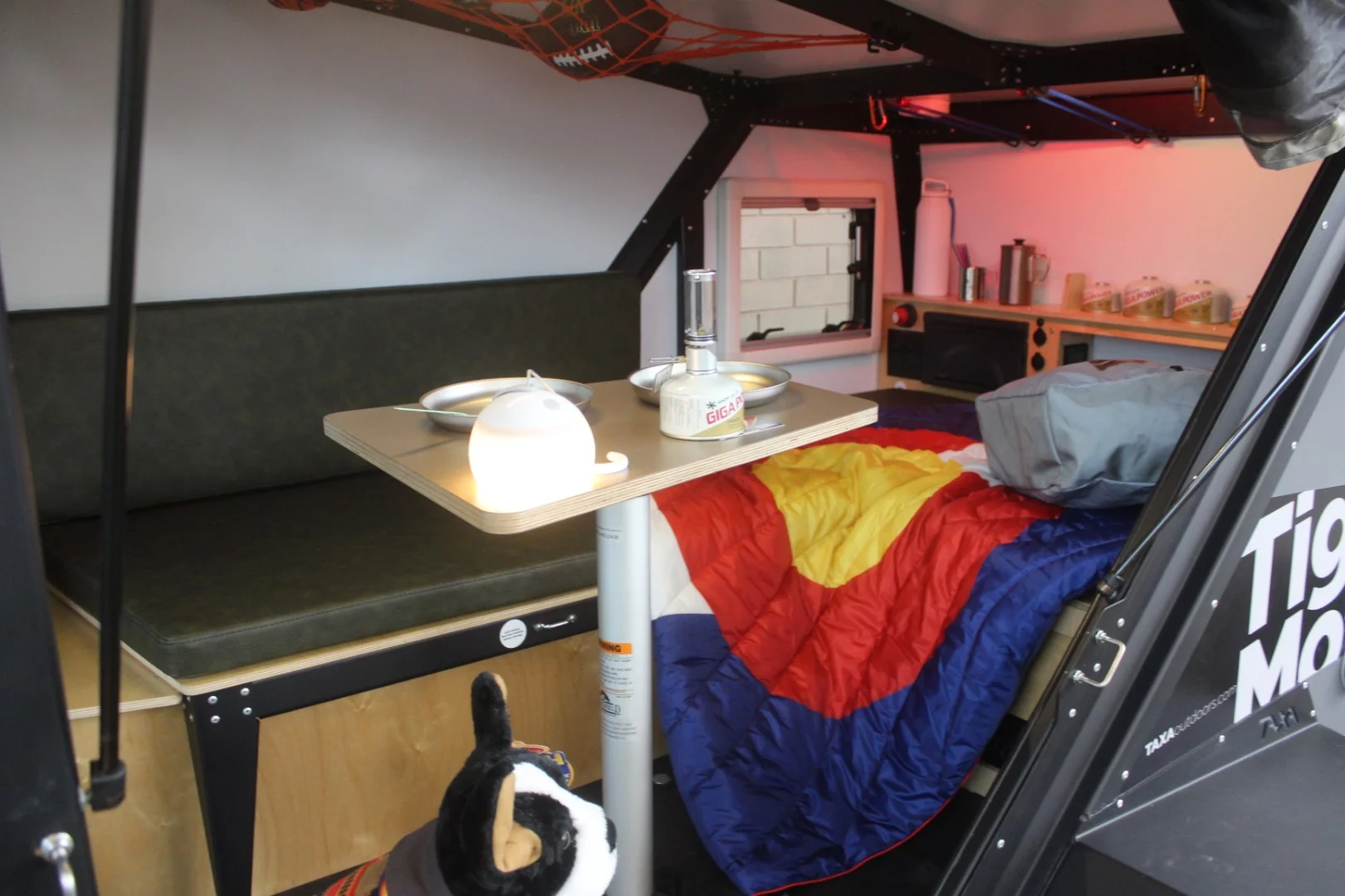 The 12-foot (3.7-m), 1,300-lb (590-kg) Tigermoth slots below the Taxa Cricket as a two-sleeper off-grid adventure trailer that offers plenty of fresh air with two hatches