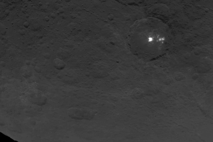 Eight smaller white spots are visible next to the primary spot in this image shot from Dawn on June 9