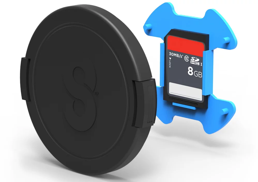 The Snapper Cap protects a lens and adds the storage space needed for stowing a spare memory card