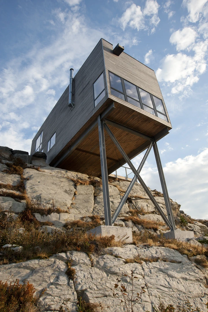 From Mackay Lyons Sweetapple Architects comes this excitingly cantilevered cabin, half hanging off a steep cliff. The cedar-lined structure sits facing the Atlantic coast in Nova Scotia