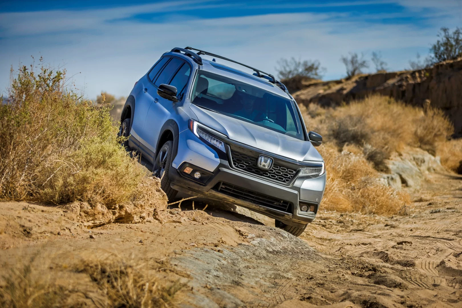 The AWD system in the Honda Passport has driver-selectable drive modes for sand, snow, and mud