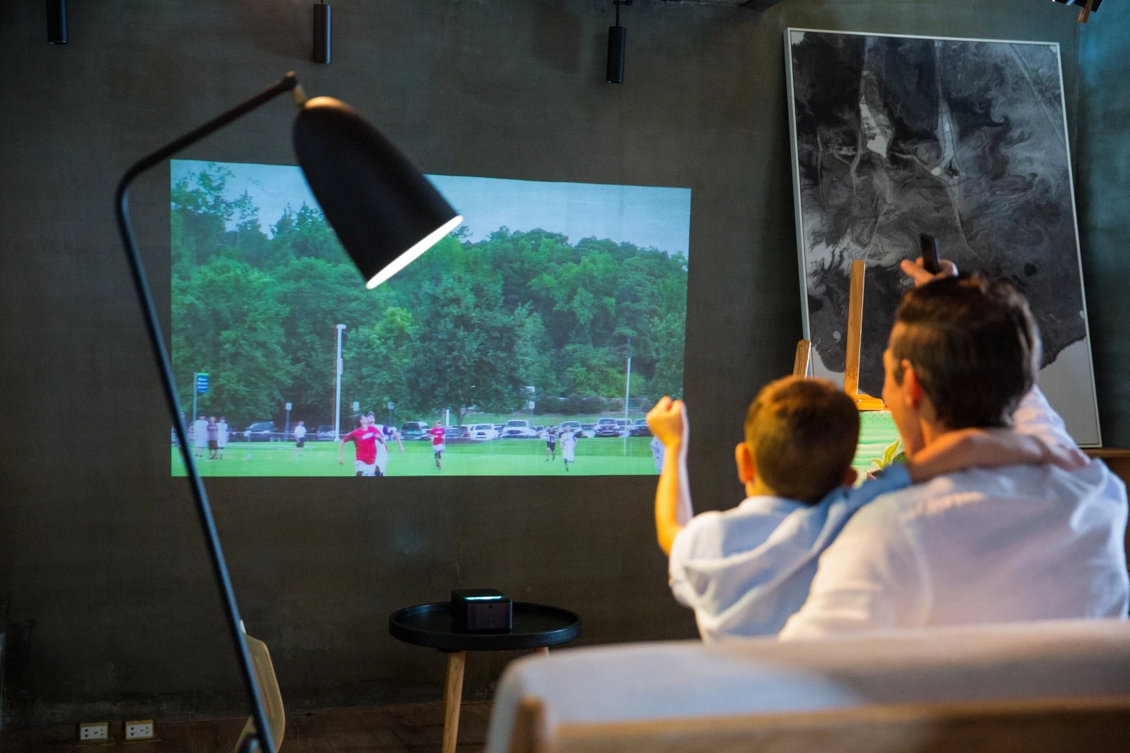 The puppy cube can be used to stream a movie or sports show onto a nearby wall, with a recommended throw of 23 - 40 diagonal inches, that can stretch up to 100 inches