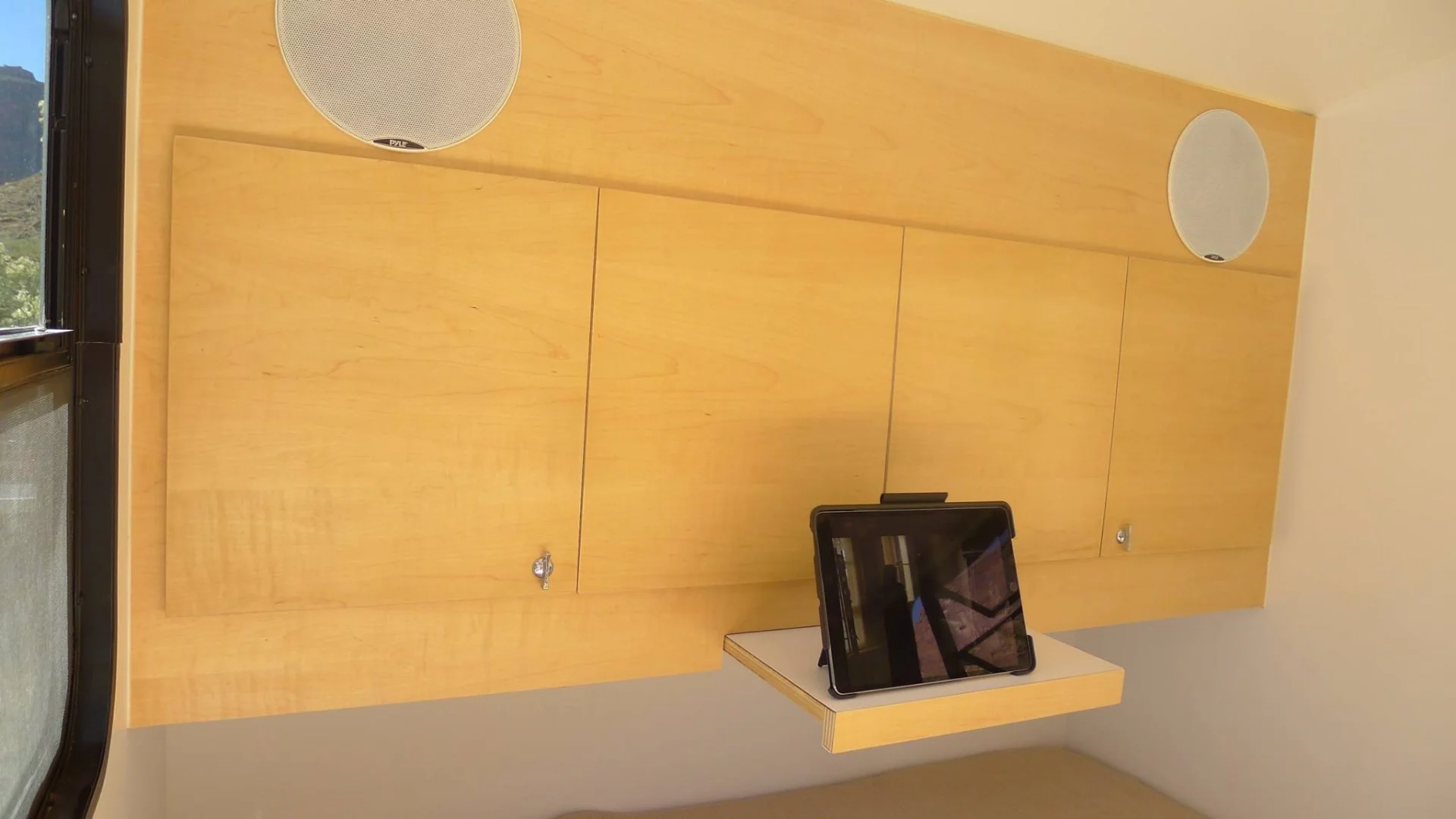 A handy slide-out shelf and available speakers provide some entertainment