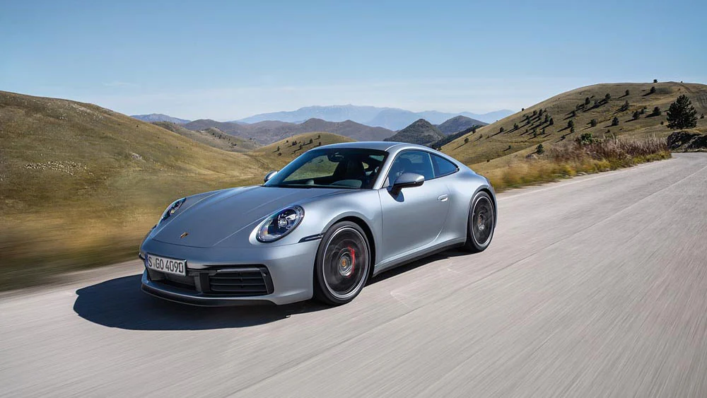 Under the hood of the new eighth-generation 911, a turbocharged flat-six engine pumps out 331 kW (450 PS)
