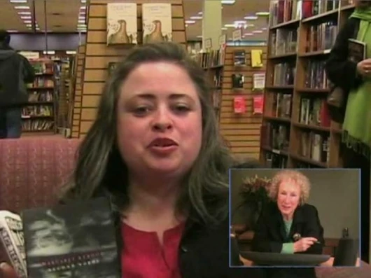 Atwood and the book recipient can see each other and themselves depending on how the LongPen is configured. Image by Unotchit.