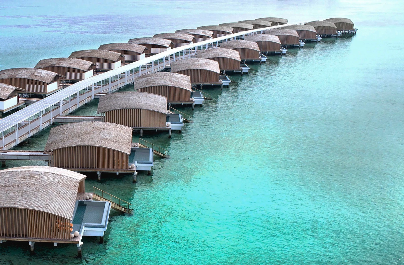 The Finolhu Villas project s self-sufficient in electricity thanks to a total of 67,000 sq ft (6,224 sq m) of photovoltaic panels and a large battery array.