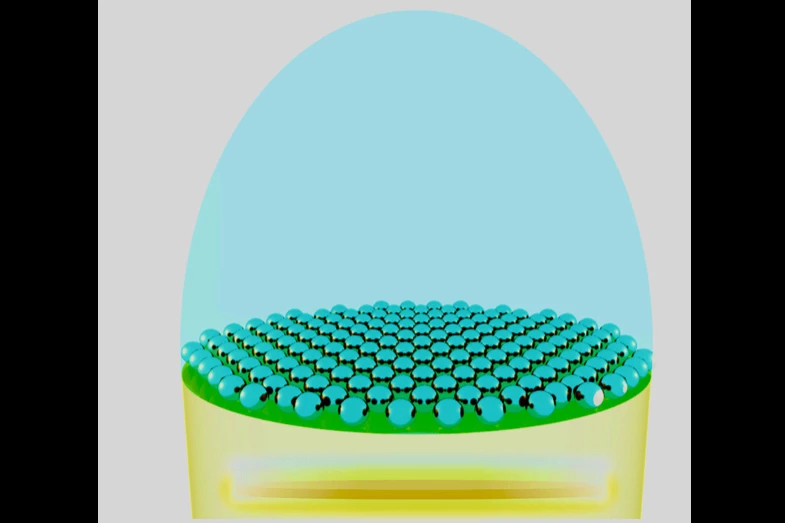 A diagram depicting the nanoparticle layer (blue dots) above the LED chip (yellow)