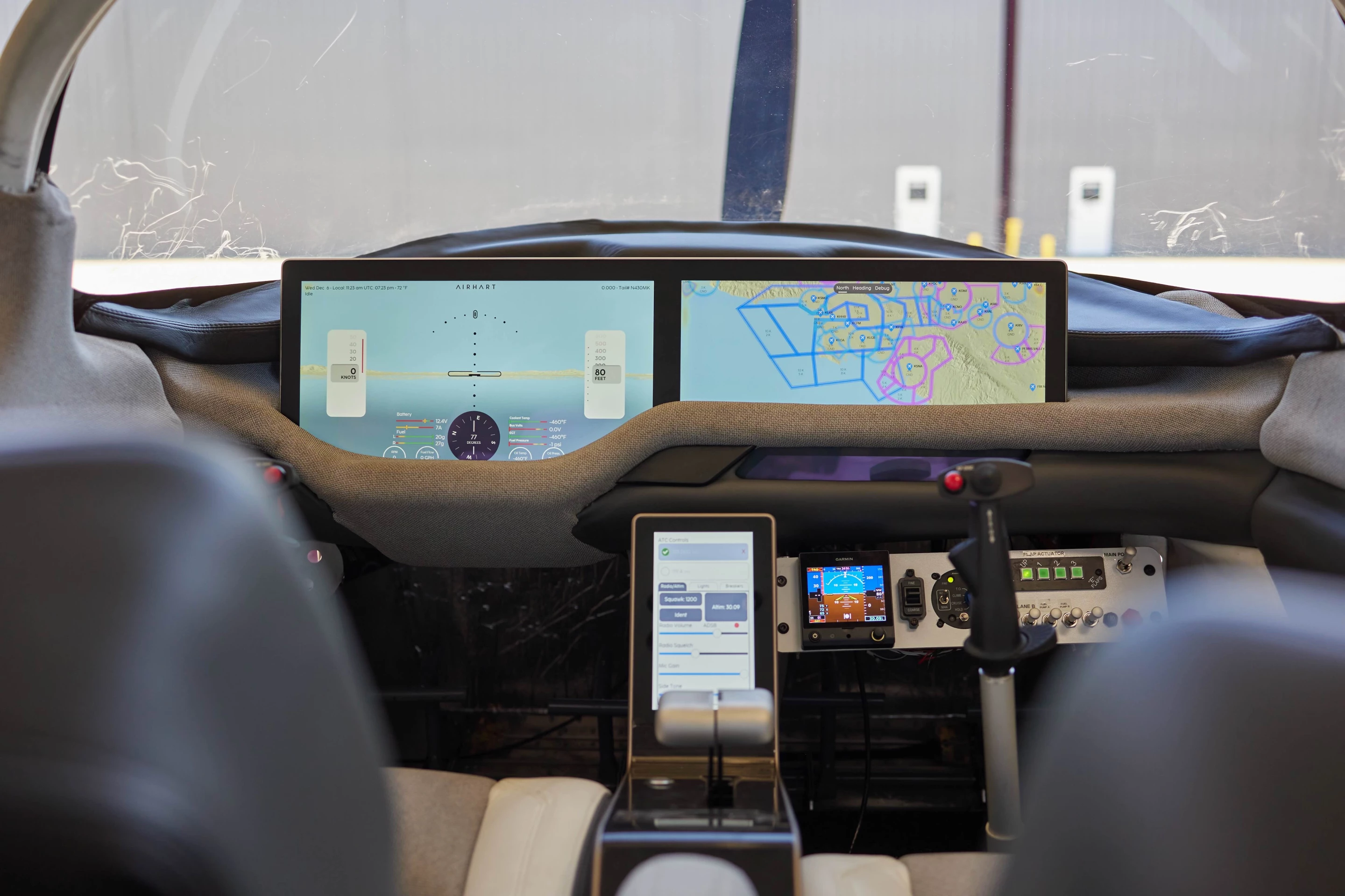 A peek inside the cockpit, with the Airhart Assist stick visible at right