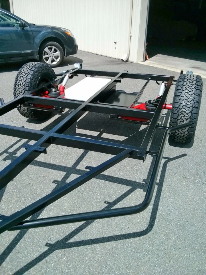 A rectangular tubular steel frame and dual trailing arm suspension help stand up to the terrain