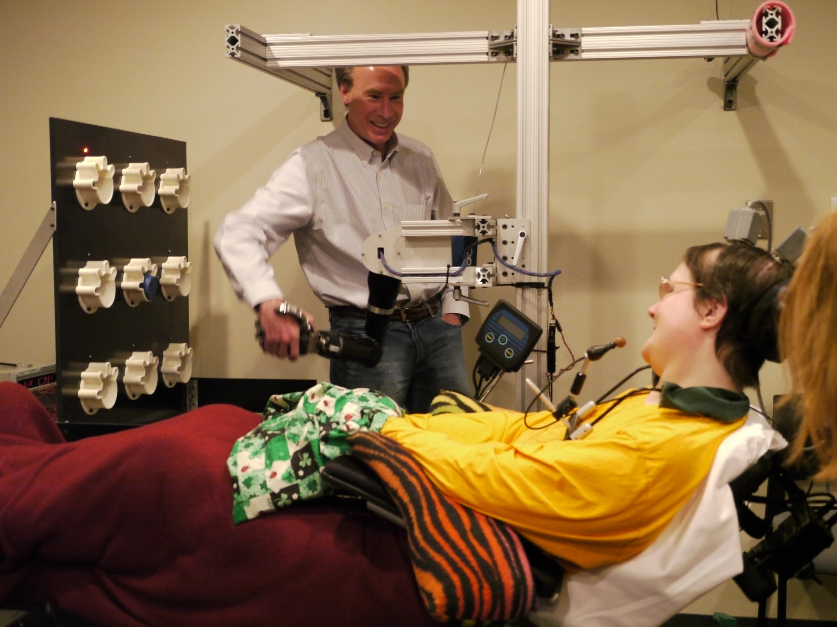 Researcher Andrew Schwartz, Ph.D., shakes Jan Scheuermann’s robot hand, which she calls Hector (Photo: UPMC)