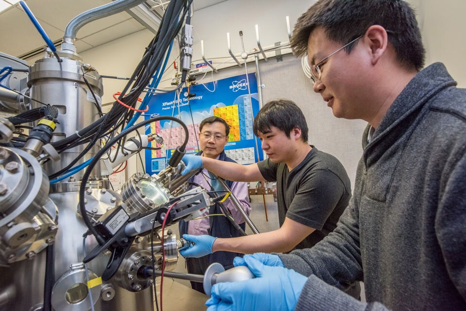 Berkeley Lab scientists Junqiao Wu, Changhyun Ko, and Fan Yang (l-r) are working at the nano-Auger electron spectroscopy instrument at the Molecular Foundry, a DOE Office of Science User Facility.