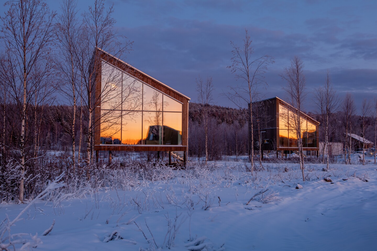 The Arctic Bath's elevated cabins feature generous glazing to maximize the view for guests