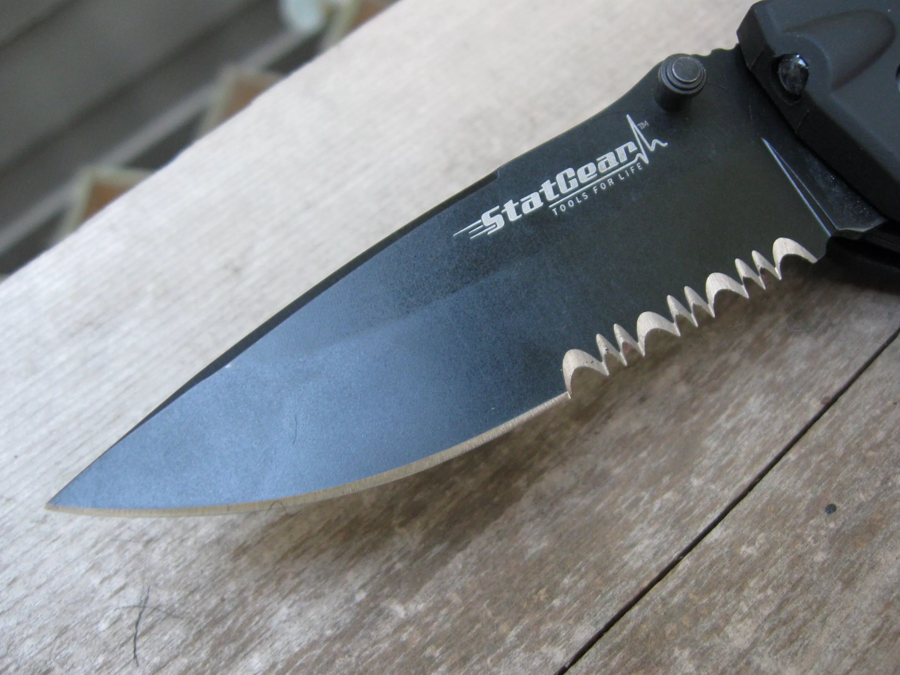 The T3's stainless steel semi-serrated blade