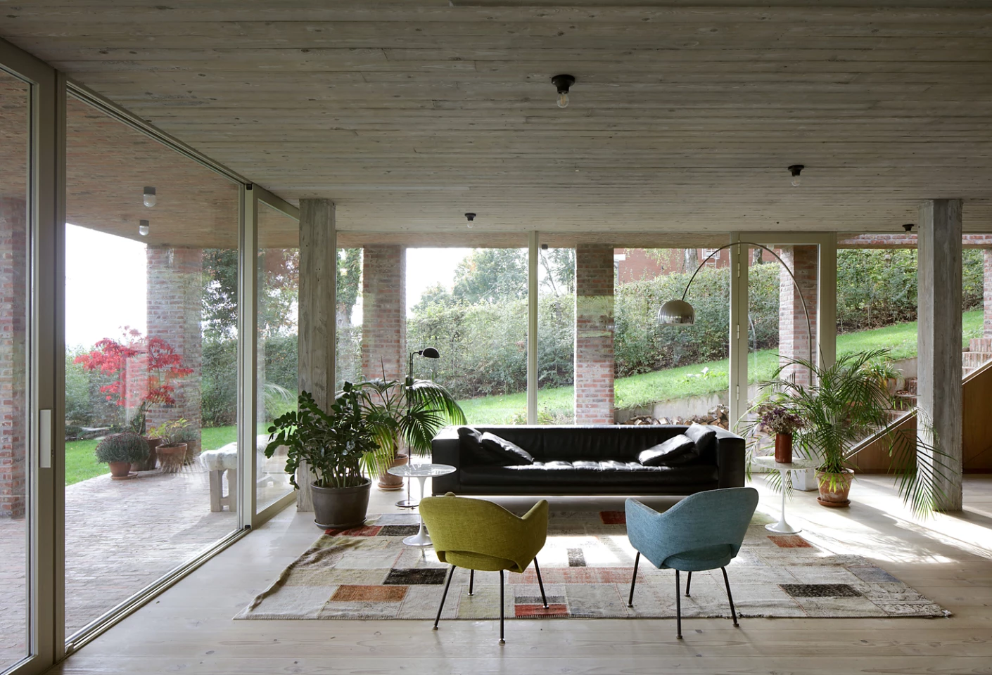 The three-bedroom single level home features a large open lounge area with floor-to-ceiling glass windows