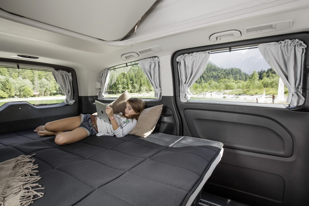 The three-seat rear bench folds down into a bed for up to three