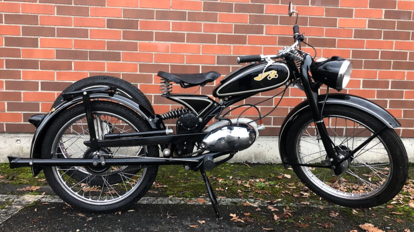 Take a close look at this 1951 Riedel Imme R100 Luxus and you'll realize just how economical the designers have been with raw materials. Sadly, it is a design triumph that executed badly given the metallurgy of the day and the bike is unreliable ... and now frightfully expensive to buy.