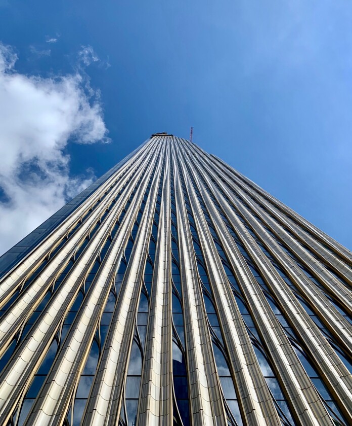 111 West 57th Street's facade is made up of terracotta panels with 22 different sets of contours contrasting with bronze detailing and a glass curtain wall