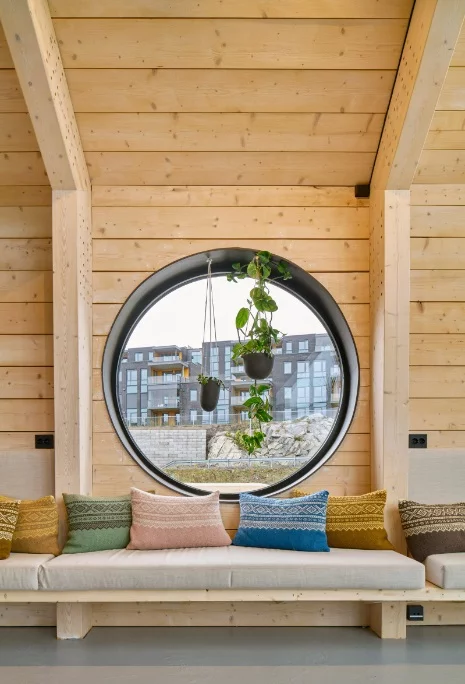 The interior design features warm timber paneling