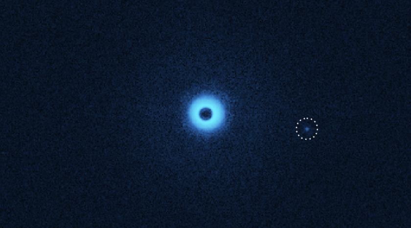 An infrared image of the binary star and the newly discovered companion, but now viewed with special polarization filters that make dust discs and exoplanets visible