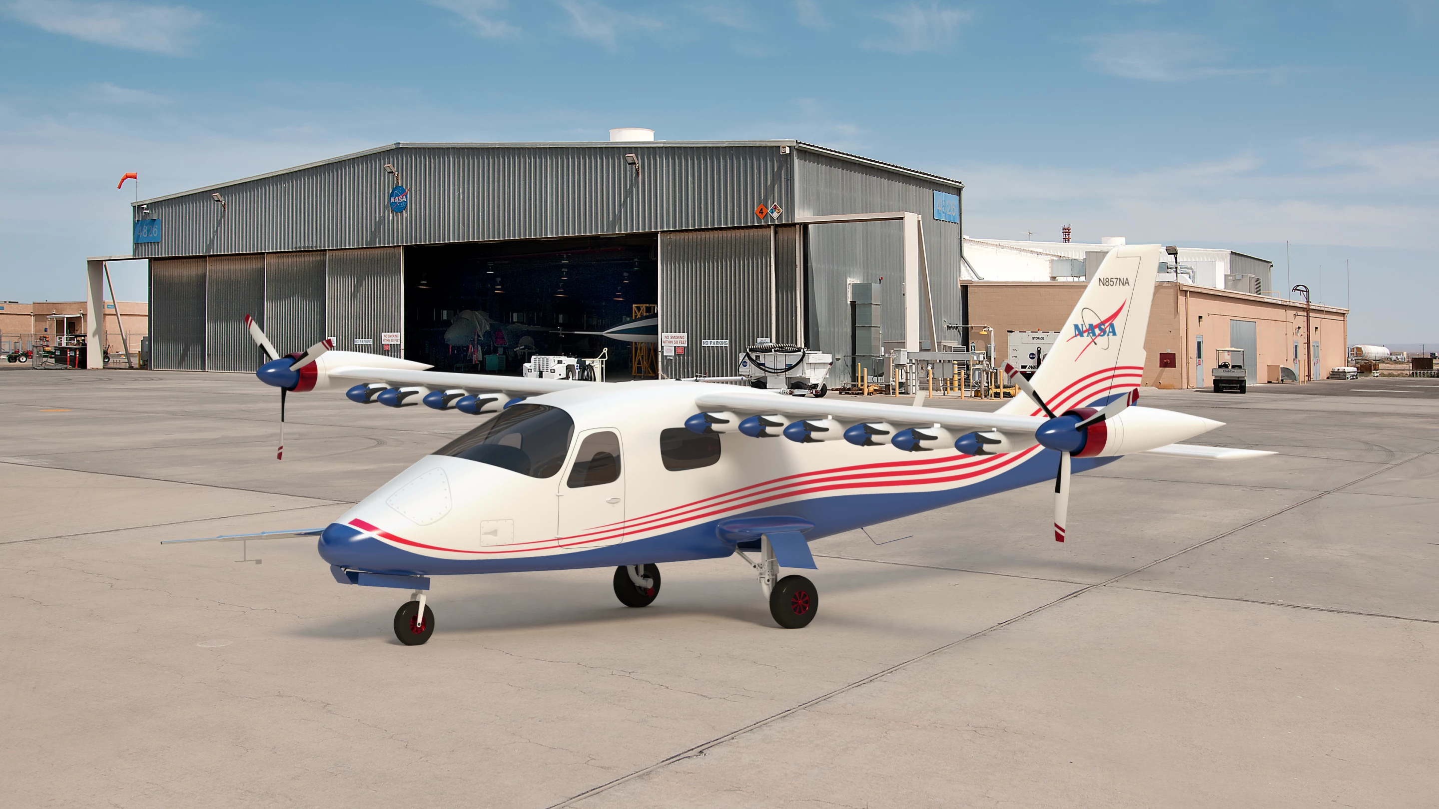 This artist’s concept image shows NASA’s first all-electric X-plane, the X-57 Maxwell, sitting in its final configuration in front of a hangar at NASA’s Armstrong Flight Research Center in Edwards, California