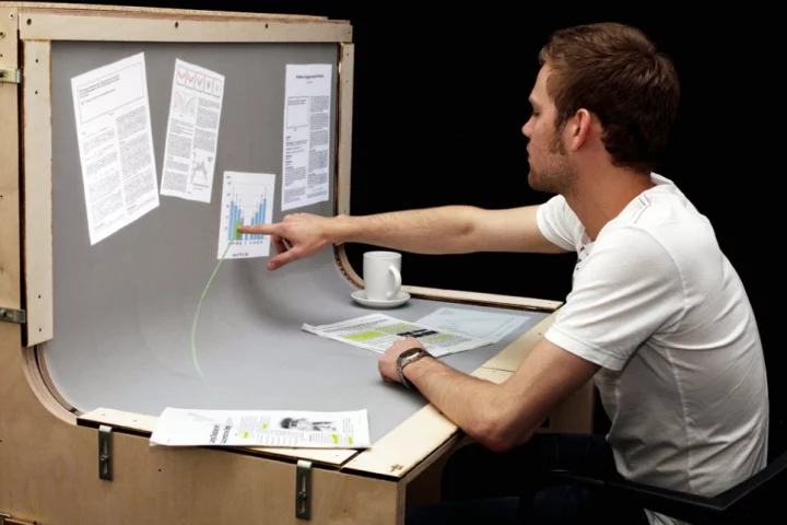 BendDesk renders the horizontal desktop and vertical display screen into one multi-touch surface via a curve in the middle