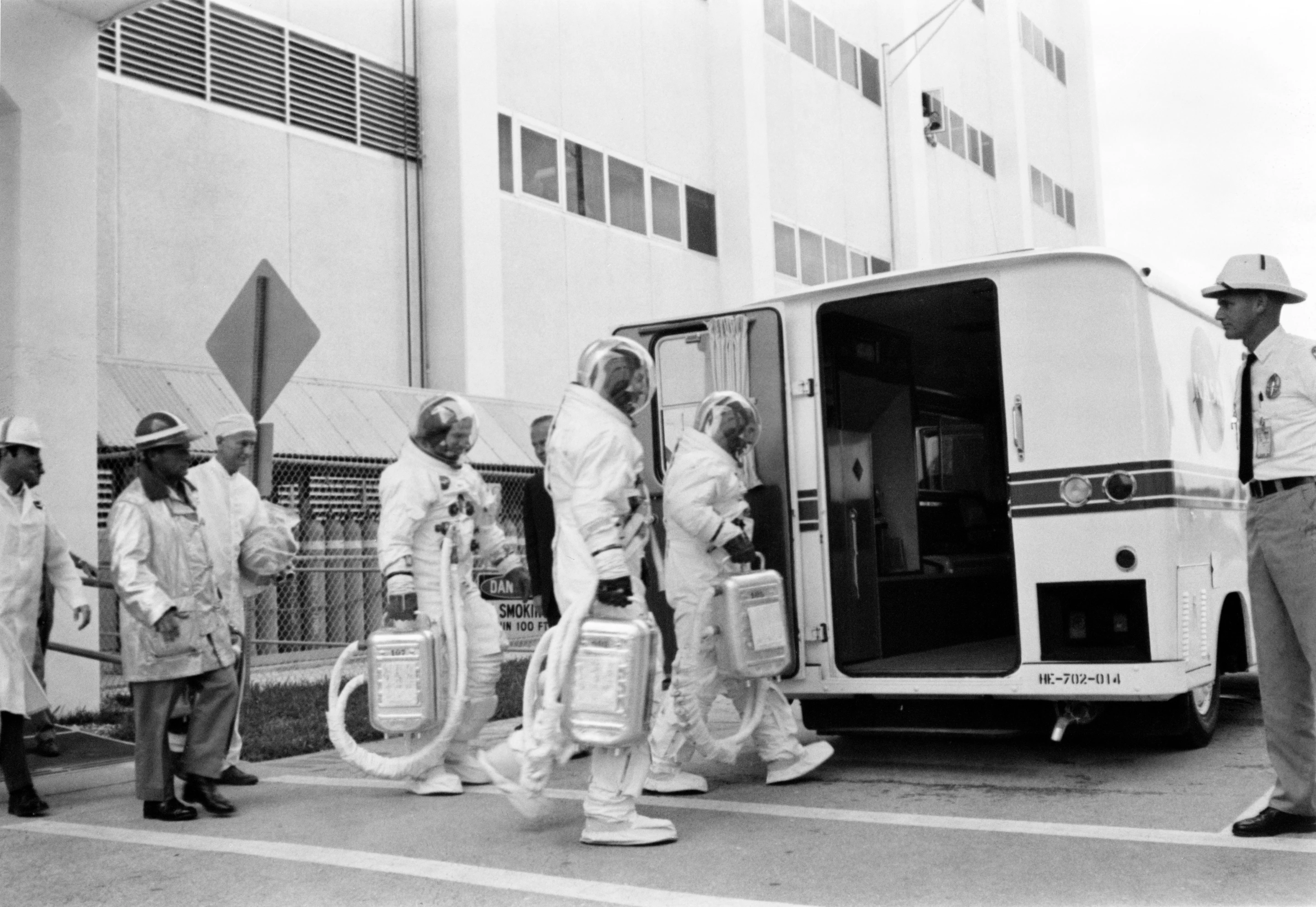 Apollo 7 crew entering transfer van at the MSOB