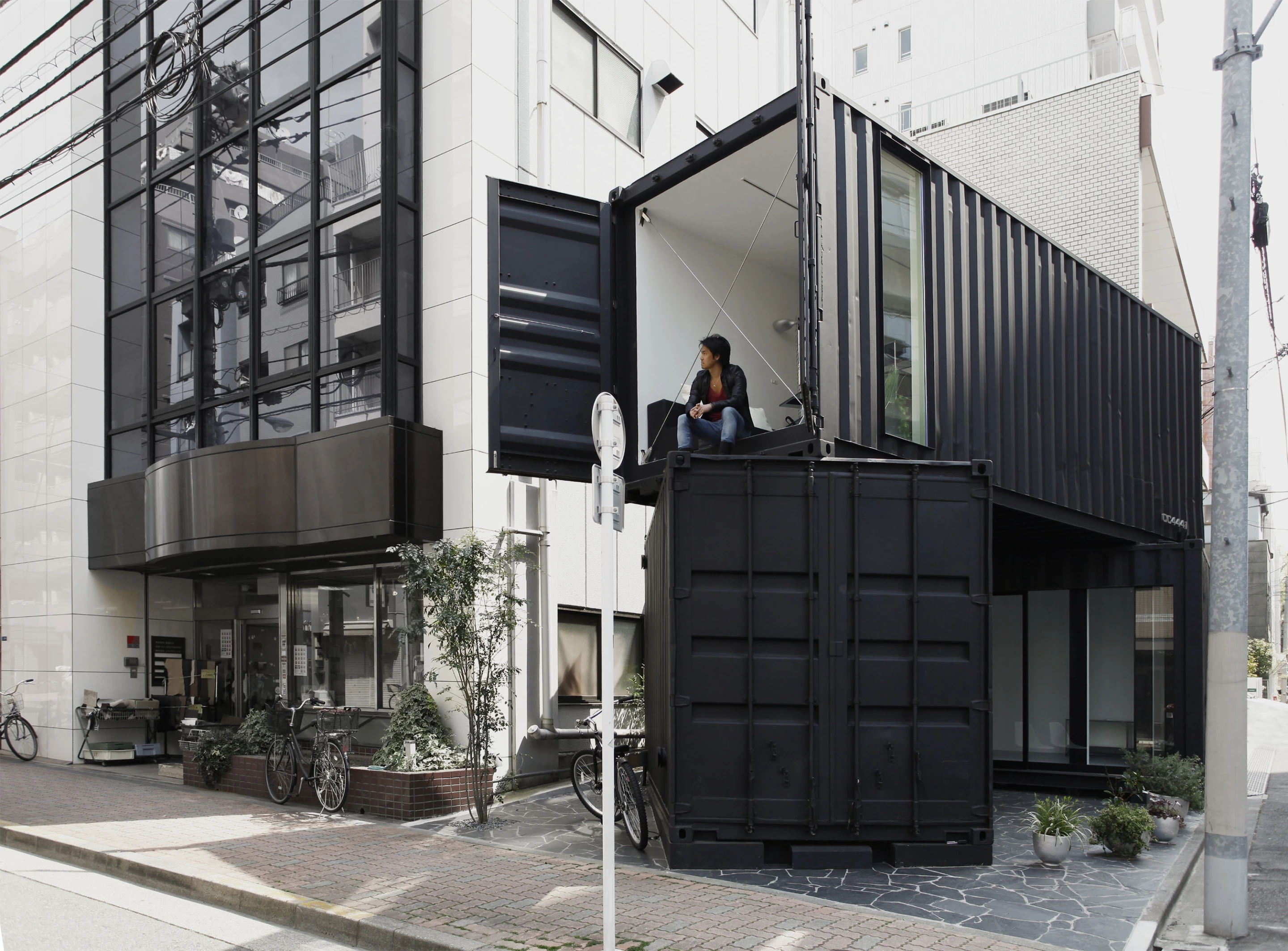 Double story container site disguises a modern office space designed by Japanese architectural firm, Tomokazu Hayakawa