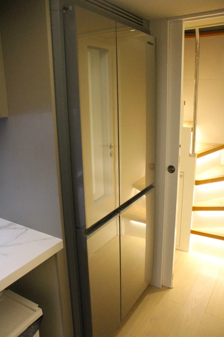 Large refrigerator with built-in wine/spirits compartment