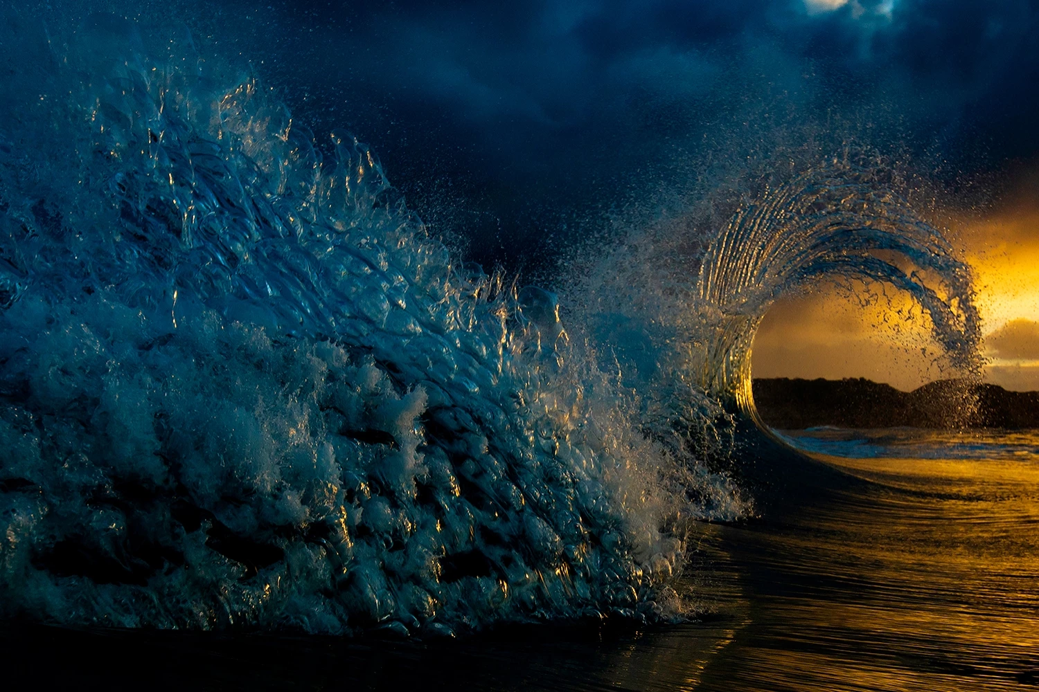 Honorable Mention, Nature. Two waves collide under a stormy sky on Victoria's Mornington Peninsula, Australia