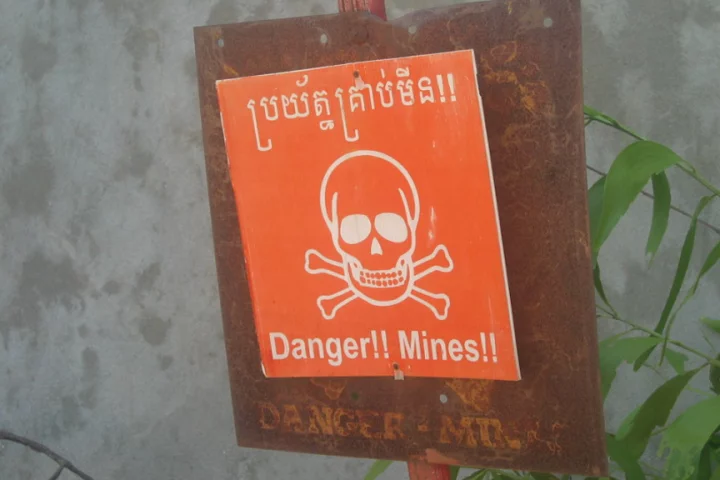 A land mine warning - a sight all to common in many parts of the world (Image: Kyle Simourd via Flickr)