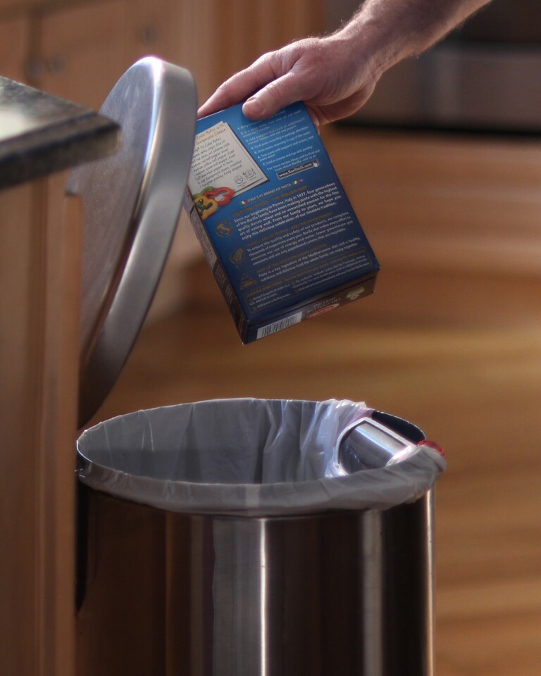 The barcodes of used products are scanned as they are thrown away